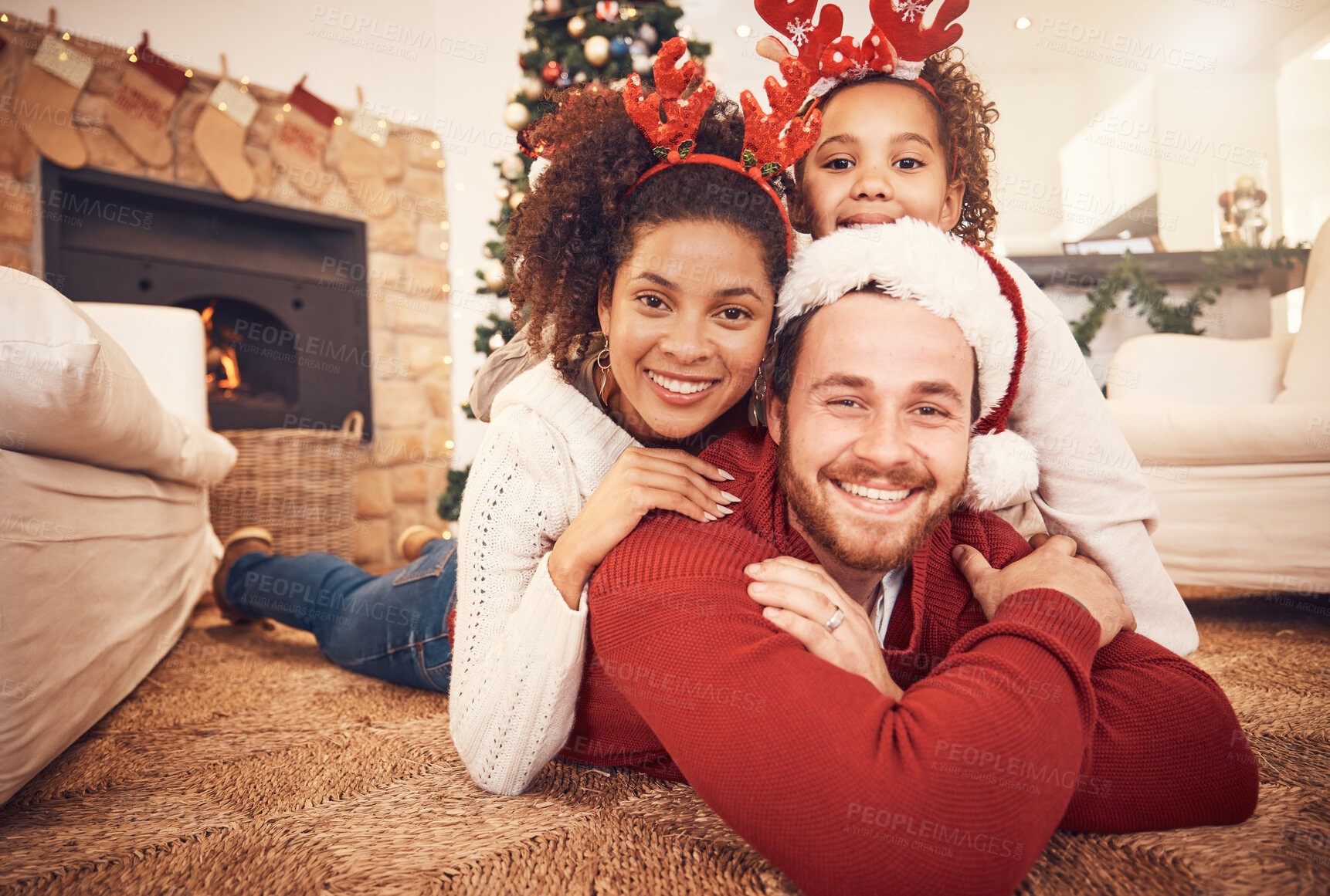 Buy stock photo Christmas, happy family and portrait in home on floor, bonding and together. Xmas, smile and face of parents with girl, interracial and African mom with father for party, celebration and holiday