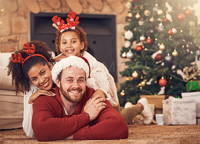 Buy stock photo Christmas, portrait and happy family in house on floor, bonding and together. Xmas, smile and face of parents with child, interracial and African mother with father for party, celebration and holiday