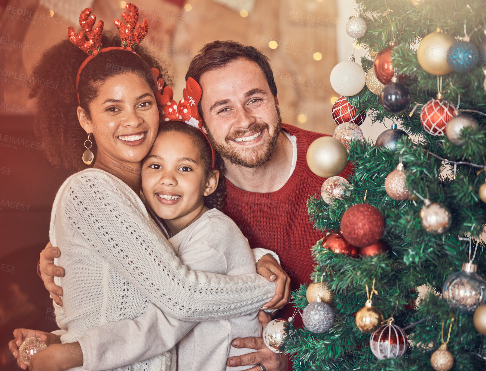 Buy stock photo Christmas, happy family and portrait in home, hug and bonding together. Xmas, smile and face of parents with girl, interracial kid and African mom embrace father for party, celebration and holiday