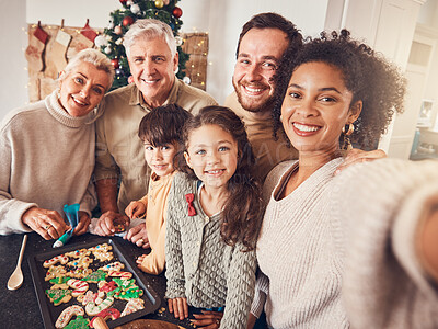 Buy stock photo Christmas, portrait and selfie of family cooking cookies in home kitchen, bond and together. Xmas, baking food and happy face of grandparents, children and interracial parents with picture on holiday