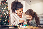 Baker, kid and mother on christmas with smile or teaching to make food in kitchen for celebration. Happy child, parent and education with cookies in home for festive season with learning for cooking.