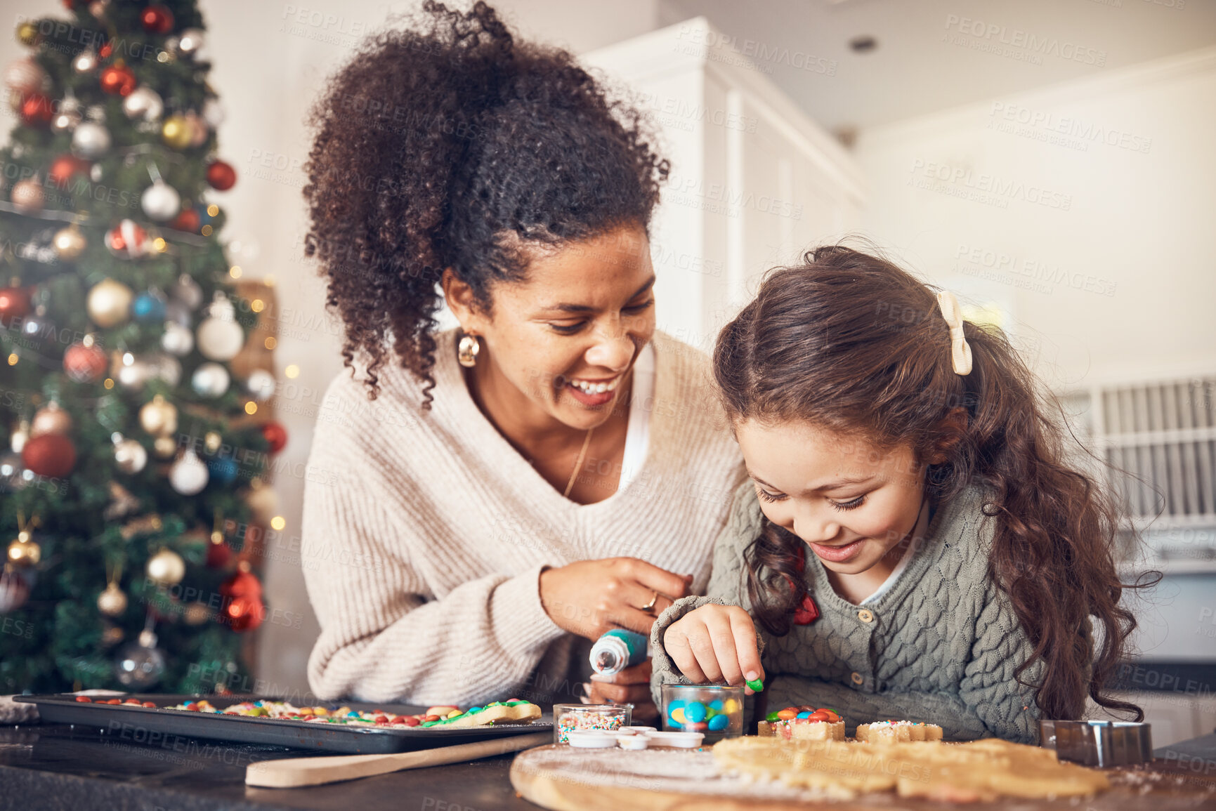 Buy stock photo Baker, kid and mother on christmas with smile or teaching to make food in kitchen for celebration. Happy child, parent and education with cookies in home for festive season with learning for cooking.