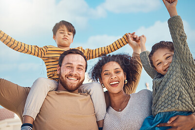 Buy stock photo Portrait, motivation and piggyback with a family cheering together against a blue sky. Diversity, love or smile with happy parents and children in the garden of their home for trust or support