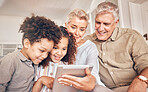 Happy, children and grandparents with a tablet in a house, streaming cartoon or a movie online. App, smile and interracial kids and senior man and woman with technology for a film, game or website