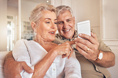 Buy stock photo Home, smile and senior couple with a smartphone, love and quality time with social media, chatting and sms. Cellphone, old man and elderly woman with happiness, mobile app and relax with connection