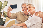 Happy senior couple, hug and selfie in relax on living room sofa for photograph, memory or vlog at home. Elderly man and woman smile for picture, photo or social media post on lounge couch together