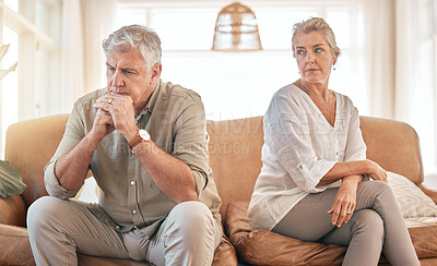 Buy stock photo Senior couple, divorce and disagreement in conflict, fight or argument on living room sofa at home. Elderly woman and frustrated man in depression, cheating affair or toxic relationship in the house