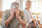 Senior couple, divorce and conflict in fight, argument or disagreement on living room sofa at home. Elderly woman and frustrated man in depression, cheating affair or toxic relationship in the house