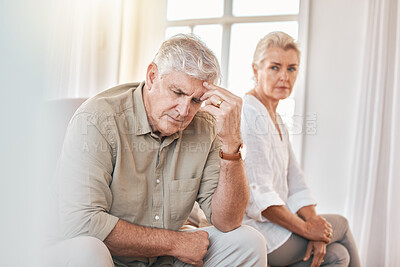 Buy stock photo Senior couple, divorce and headache in conflict, fight or argument on the living room sofa at home. Elderly woman and frustrated man in depression, cheating affair or toxic relationship in the house