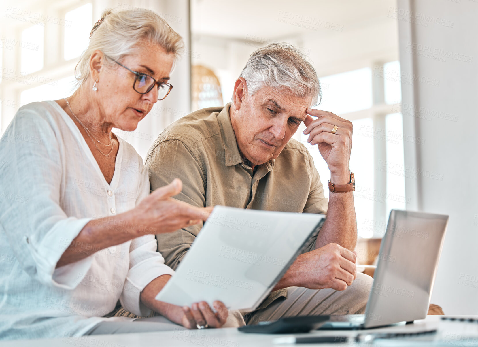 Buy stock photo Senior couple, documents and financial crisis in debt, expenses or budget planning at home. Elderly woman and frustrated man working together on finance paperwork, debit order or retirement report