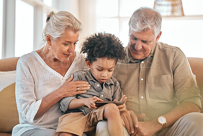 Buy stock photo Phone, grandparents and child in home, happy and bonding together in living room. Smartphone, interracial kid and grandpa and grandma in lounge streaming movie, video or internet film on social media