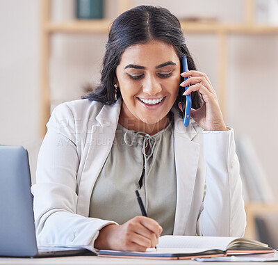 Buy stock photo Business woman, phone call and writing in office for networking, schedule and communication. Happy indian female worker talking on smartphone, planning agenda and calendar administration in notebook