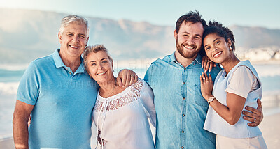 Buy stock photo Portrait, diversity and love with a blended family on the beach together in summer for vacation or holiday. Senior parents, smile and in laws with a group of people standing y by the ocean or sea