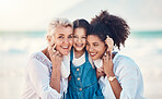 Mother, grandmother and a child portrait at the beach while on a family vacation, holiday or adventure. A senior woman, mom and girl kid together with a smile while outdoor for summer fun and travel