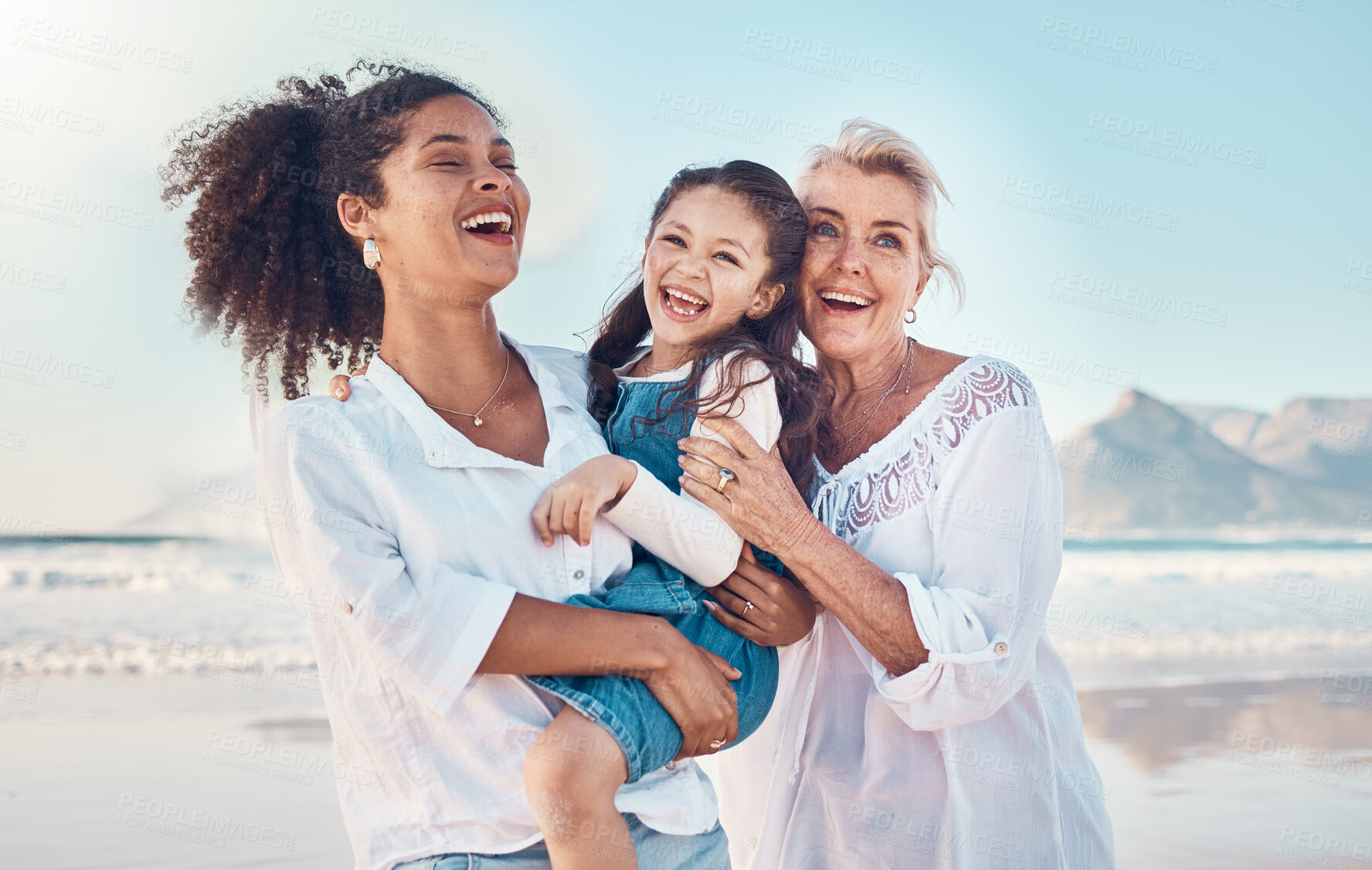 Buy stock photo Mother, grandmother and a child happy at the beach on a family vacation, holiday or adventure. Senior woman, mom and girl kid laugh together outdoor for summer fun, freedom and travel or quality time