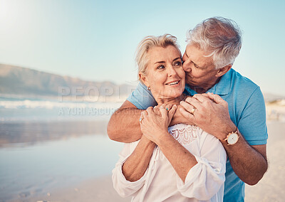 Buy stock photo Beach, love and senior couple with a kiss in nature, holiday or romantic outdoor date together at the ocean or sea. Happy, smile on face and people in a hug, embrace or happiness on anniversary