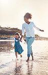 Fun, child and a mother running at the beach on a family vacation, holiday or adventure in summer. Young girl kid holding hands with woman outdoor with fun energy, happiness and love at sunset ocean