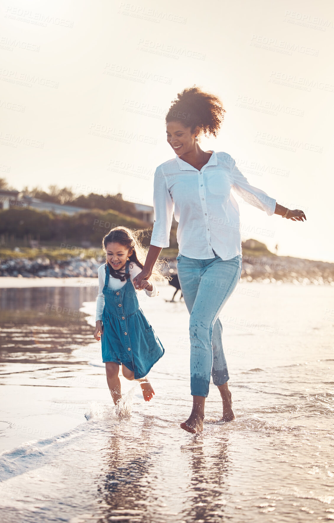 Buy stock photo Fun, child and a mother running at the beach on a family vacation, holiday or adventure in summer. Young girl kid holding hands with woman outdoor with fun energy, happiness and love at sunset ocean