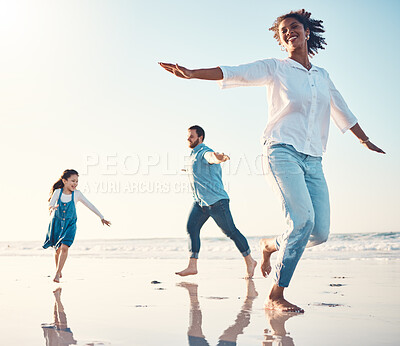 Buy stock photo Mother, father and daughter on the beach to dance together while outdoor for travel or vacation in summer. Sunset, family or children and a girl having fun with her parents on the coast by the ocean