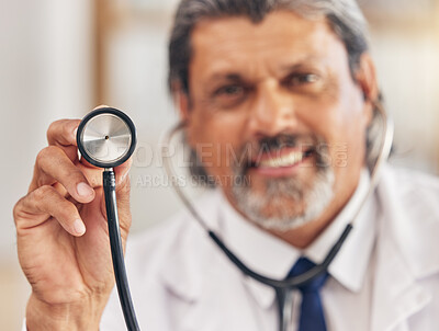 Buy stock photo Man, portrait and a doctor with a stethoscope for healthcare, consultation or medical test. Happy, hospital and a mature male nurse or surgeon with gear for a clinic, cardiology or nursing exam