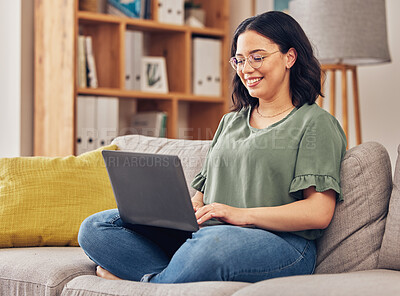 Buy stock photo Sofa, laptop and woman or student in e learning, online education and typing for university or work from home research. Computer, information or knowledge of young person on couch and college website