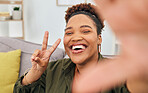Portrait, happy black woman and peace for selfie in home, online live streaming and influencer. Face of female gen z smile for profile picture, v sign and hand emoji for memory of social media post