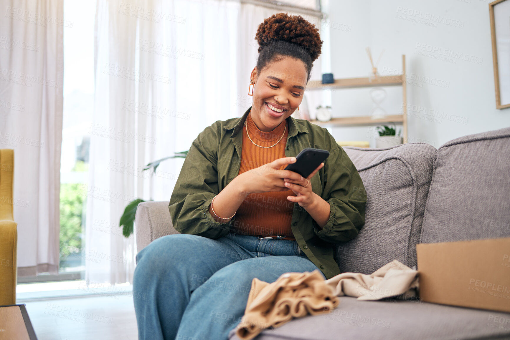 Buy stock photo Online shopping, delivery and black woman with phone on sofa happy with package or product at home. Ecommerce, smile and African lady with smartphone for customer experience, survey or app in house