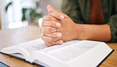 Hands, bible and prayer in home, closeup and mindfulness for faith, religion or reading with hope for life. Woman, praying and study holy book for peace, mental health and worship with praise to God