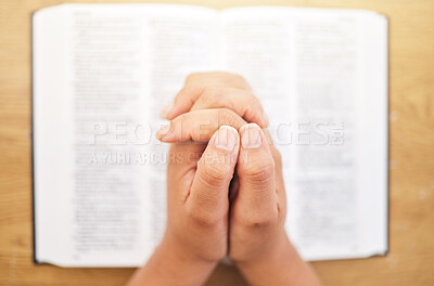 Buy stock photo Hands, bible and desk for prayer, closeup and mindfulness for faith, religion or reading in pov. Woman, praying and study holy book for peace, mental health and worship with praise to God in top view