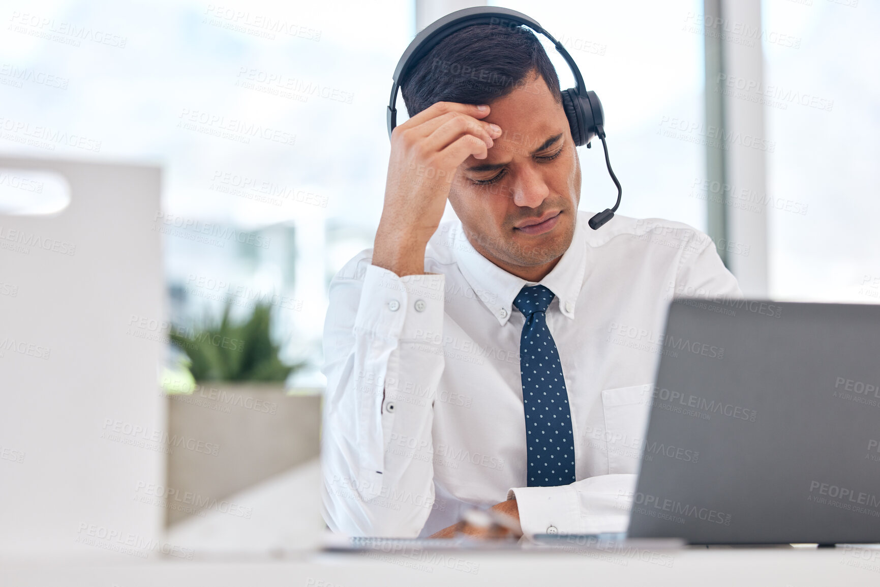Buy stock photo Call center, working and man with a headache or businessman in customer service with stress, burnout or fatigue. Tired, exhausted or consultant in office with a migraine, pain or anxiety from crm