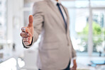 Closeup of a businessman stretching for a handshake in the office for partnership, greeting or agreement. Success, welcome and zoom of professional male person with shaking hands gesture for welcome.