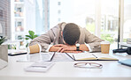 Tired business man sleeping at desk with burnout, stress problem and low energy in office. Fatigue, frustrated and sad male employee in nap for bad time management, deadline and depression of mistake