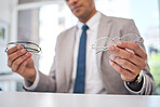 Optometry, choice and closeup of a man with glasses for eye care, optical wellness or health. Vision, healthcare and zoom of a male person choosing frame for prescription spectacles or lens in store.