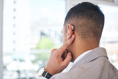 Buy stock photo Back, business man and hearing aid for ear, sound amplifier and audio communication in company office. Professional, person with a disability and deaf with implant technology to help with listening