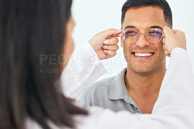 Buy stock photo Eye care, glasses and happy man with lens from optician for vision, eyesight and optical frames. Face of customer, optometrist and check spectacles for prescription assessment, test eyes and services