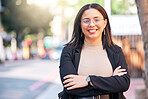Portrait, designer and woman with arms crossed in city, urban street or outdoor. Face, glasses and confidence of creative professional, employee smile and happy worker from Brazil for business career
