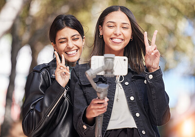 Buy stock photo Wink, selfie and peace sign with friends in city for social media, happy and support. Happiness, profile picture and live streaming with women outdoor for internet, post and youth together