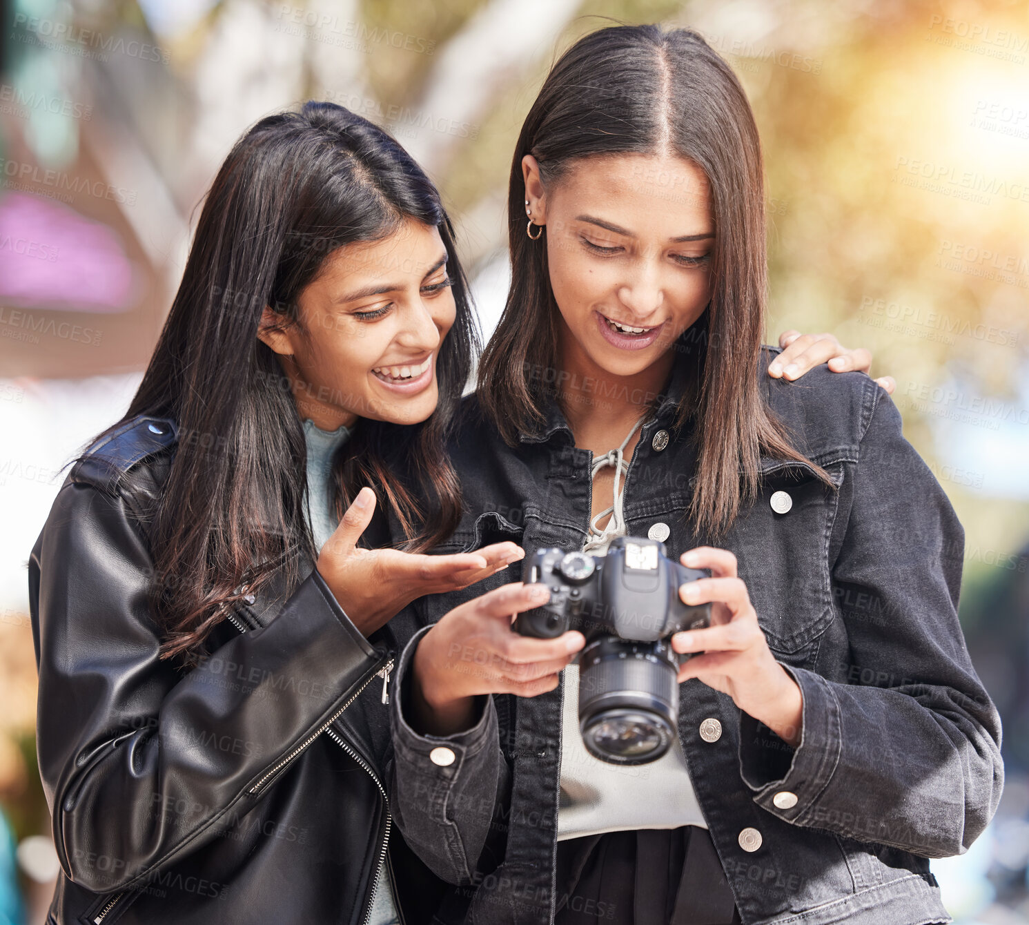 Buy stock photo Photography camera, city and happy friends check photo, picture or urban photographer, women or tourist shooting. Creative photoshoot, sidewalk and gen z youth, students or young people analyse shot
