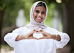 Hands in heart, park and portrait of Muslim woman for support, love symbol and care outdoors. Happy, emoji and face of Islamic female person with hijab and hand sign for kindness or peace in nature
