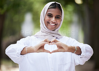 Buy stock photo Hands in heart, park and portrait of Muslim woman for support, love symbol and care outdoors. Happy, emoji and face of Islamic female person with hijab and hand sign for kindness or peace in nature