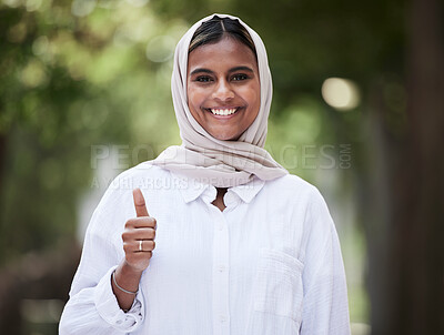 Buy stock photo Thumbs up, happy and portrait of Muslim woman in park for support, agreement and yes outdoors. Happiness, smile and face of Islamic female person with hand sign for approval, thank you and success
