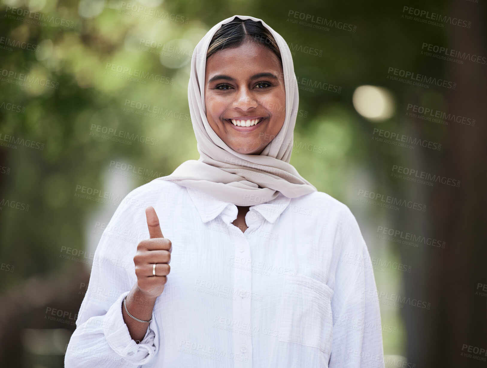 Buy stock photo Thumbs up, happy and portrait of Muslim woman in park for support, agreement and yes outdoors. Happiness, smile and face of Islamic female person with hand sign for approval, thank you and success