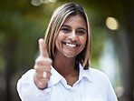 Portrait, smile and thumbs up with a woman in nature, outdoor on a green background for support or motivation. Face, thank you and like emoji with a happy young person standing in a park to say yes