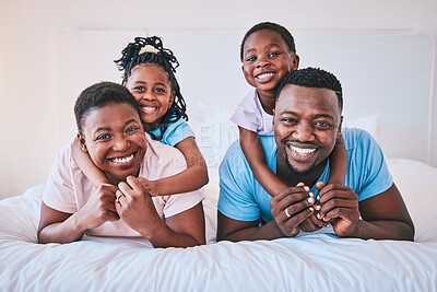 Buy stock photo Smile, black family and portrait in a bed happy, care and comfort on the weekend in their home. Face, love and children with parents in bedroom playing, hug and relax while having fun together