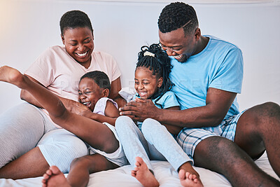 Buy stock photo Laugh, black family and tickle in a bed with smile, care and happy on the weekend in their home. People, playing and children with parents in bedroom with games and having fun in the morning together