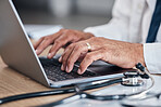Doctor, hands and laptop for healthcare research, hospital management and admin or planning and clinic information. Medical professional working or typing on computer for telehealth services and FAQ