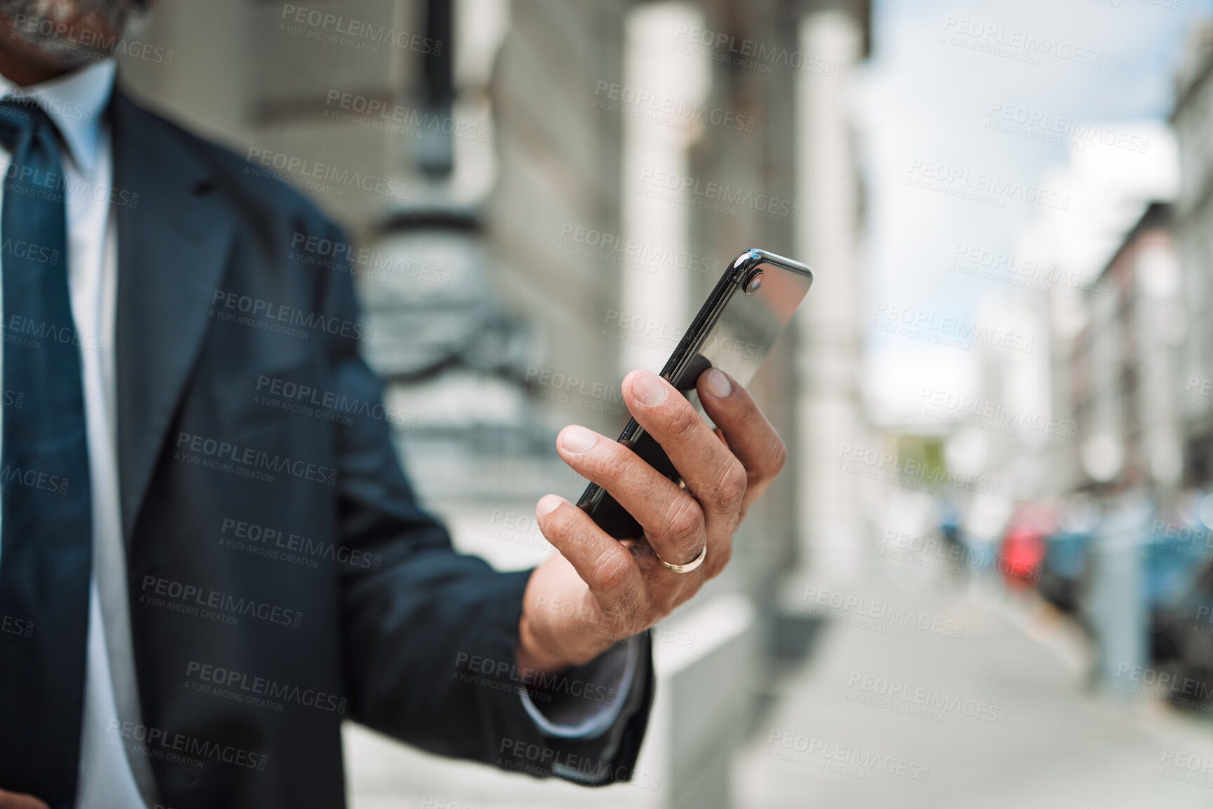 Buy stock photo Hands, phone and travel with a business man in the city using an app for location, navigation or direction. Mobile, commute and communication with a male employee typing a message in an urban town