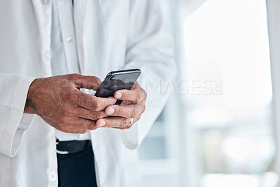 Buy stock photo Phone, hands and doctor typing in hospital for research, telehealth and healthcare. Smartphone, medical professional and surgeon, expert or person on mobile app, wellness email or online consultation