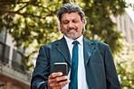 Senior businessman, phone and texting in street with smile, thinking and communication on internet. Mature entrepreneur man, smartphone and networking with web chat, social media and contact on app