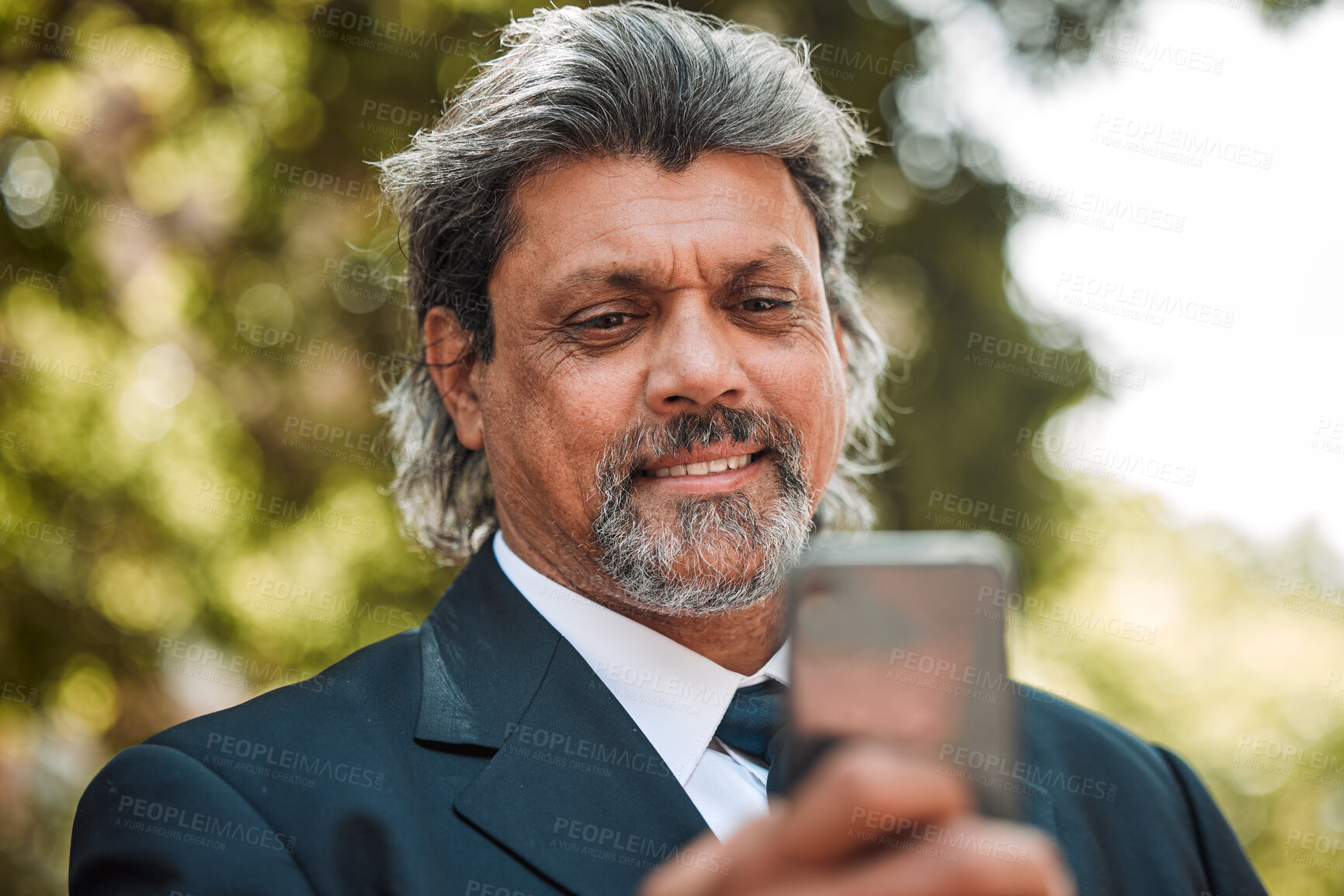 Buy stock photo Face, phone and communication with a business man outdoor on his morning commute for work. Mobile, contact and networking with a senior male CEO or manager reading a text message or social media post